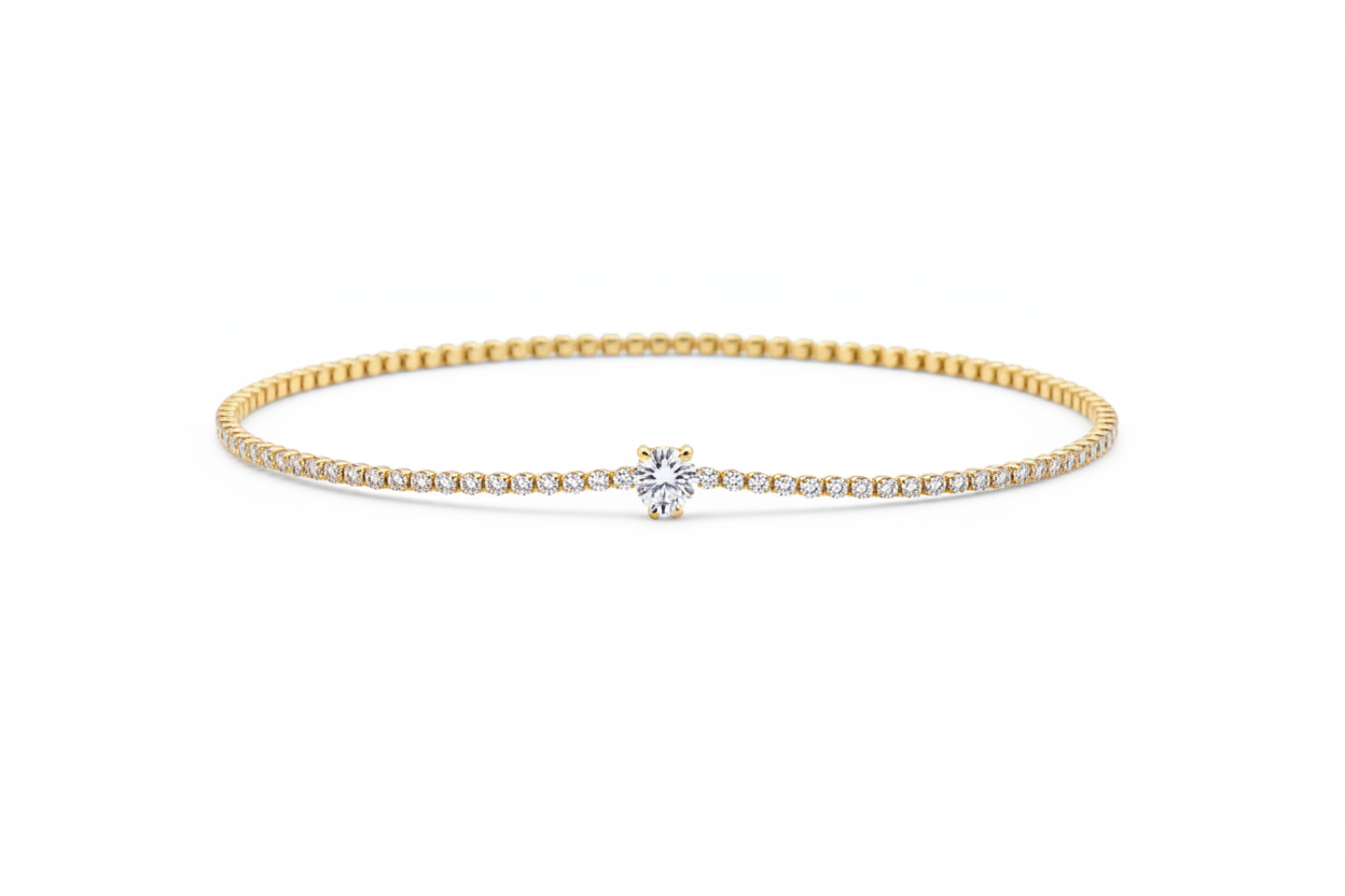 10k gold delicate pavé diamond tennis bracelet with round brilliant solitaire center on white background