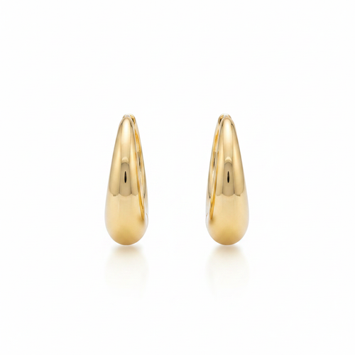 10k gold chunky oval huggie hoop earrings on white background